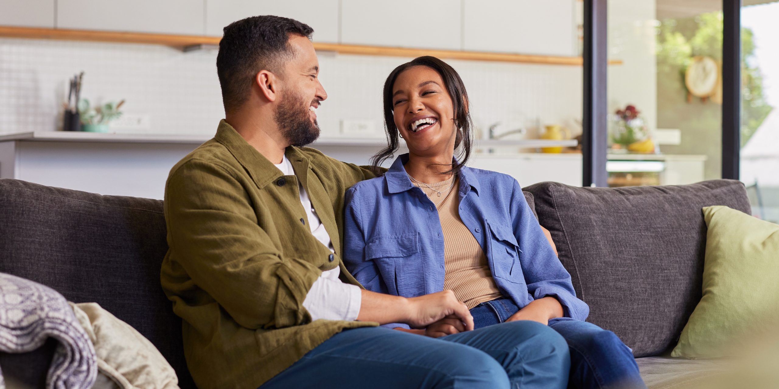 Smiling, happy couple at home.